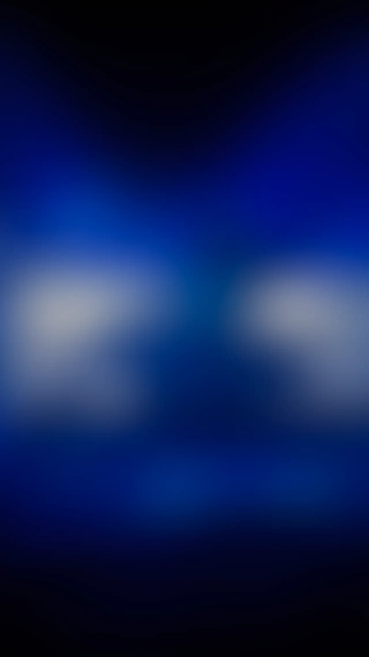 Blurred stage visual for an AI conference, under NDA