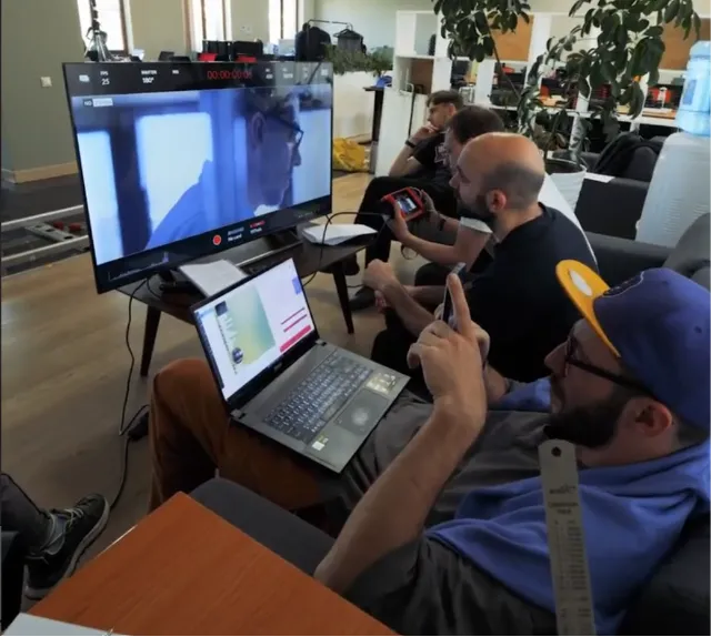 Reviewing takes with the team in post